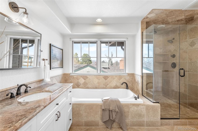 full bathroom featuring tile patterned floors, a shower stall, vanity, and a bath