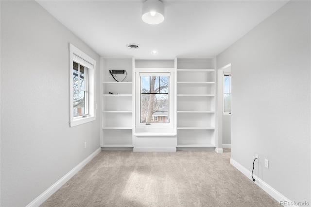 interior space featuring carpet, visible vents, and baseboards