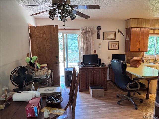 3910 E Orchard Rd, Centennial, CO 80121 - office space featuring a textured ceiling, light wood finished floors, and ceiling fan