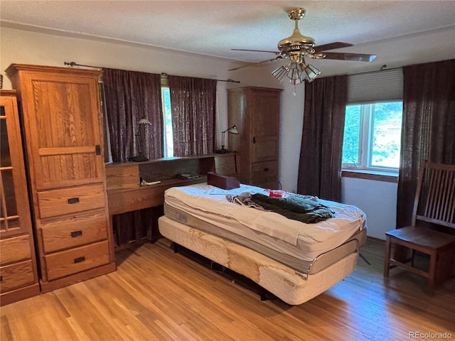 3910 E Orchard Rd, Centennial, CO 80121 - bedroom featuring light wood-style floors and ceiling fan