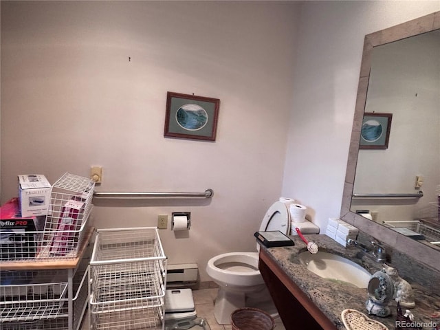 3910 E Orchard Rd, Centennial, CO 80121 - bathroom with vanity, a baseboard heating unit, and tile patterned flooring