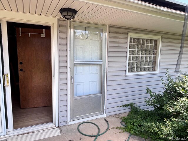 3910 E Orchard Rd, Centennial, CO 80121 - doorway to property featuring covered porch