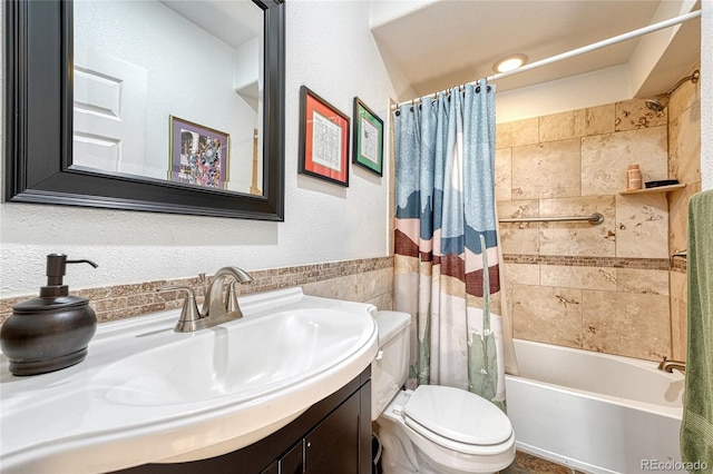 full bathroom featuring vanity, tile walls, shower / bathtub combination with curtain, and toilet