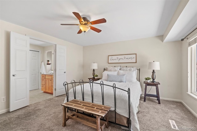 bedroom with light colored carpet, baseboards, and multiple windows