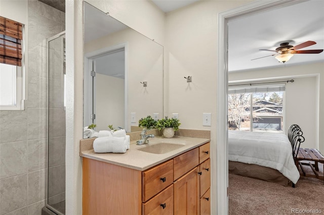 bathroom with a shower stall, ensuite bath, vanity, and a ceiling fan