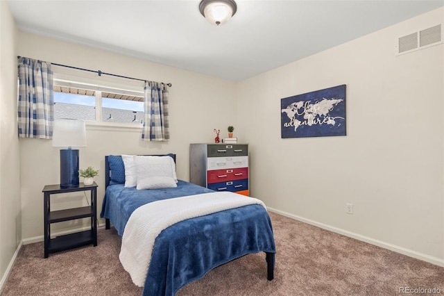 bedroom featuring visible vents, carpet floors, and baseboards