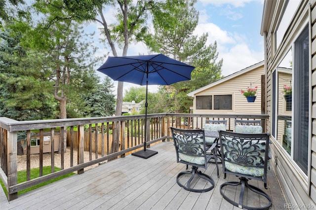 deck with outdoor dining area