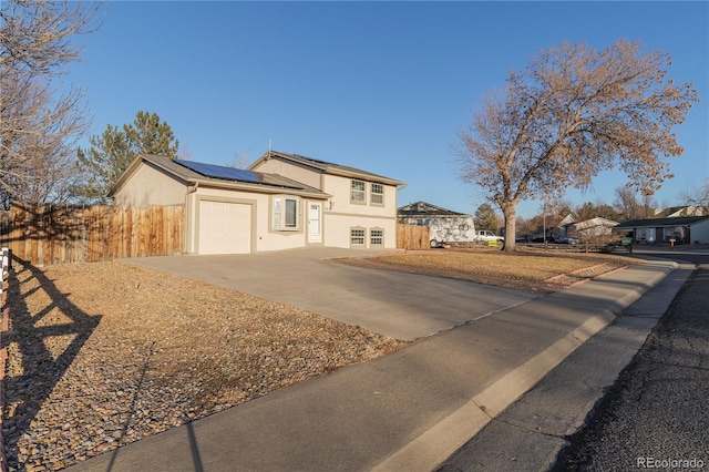 view of front of home featuring solar panels