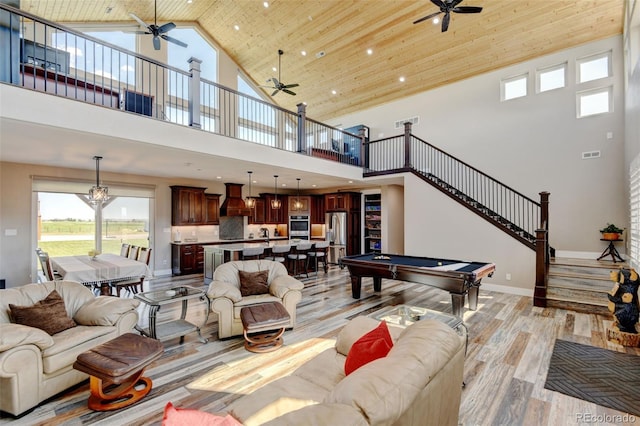 3308 County Road 19, Fort Lupton, CO 80621 - living area featuring ceiling fan, high vaulted ceiling, light wood-style flooring, billiards, and wooden ceiling
