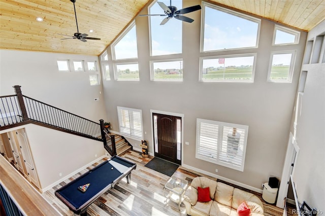 3308 County Road 19, Fort Lupton, CO 80621 - foyer entrance featuring high vaulted ceiling, wood ceiling, ceiling fan, wood finished floors, and baseboards