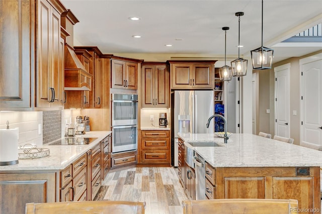 3308 County Road 19, Fort Lupton, CO 80621 - kitchen with stainless steel appliances, light wood-style floors, brown cabinets, decorative backsplash, and recessed lighting