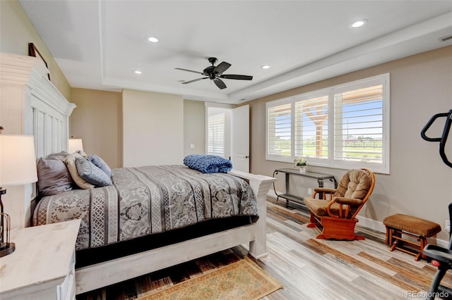 3308 County Road 19, Fort Lupton, CO 80621 - bedroom with light wood-type flooring, recessed lighting, a raised ceiling, ceiling fan, and baseboards