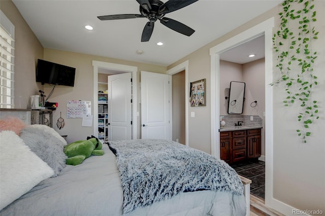 3308 County Road 19, Fort Lupton, CO 80621 - bedroom with a sink, recessed lighting, ensuite bathroom, a ceiling fan, and baseboards