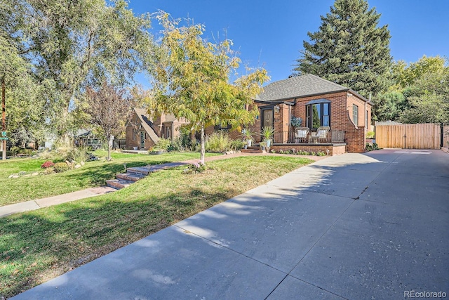 view of front of property with a front lawn and a porch