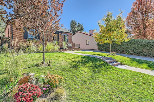 view of yard featuring a wooden deck