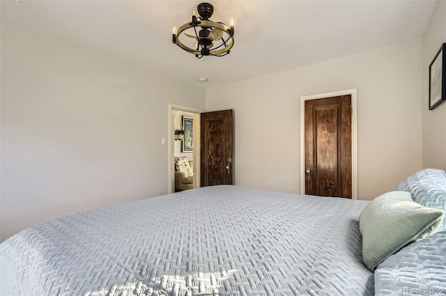 bedroom with a notable chandelier