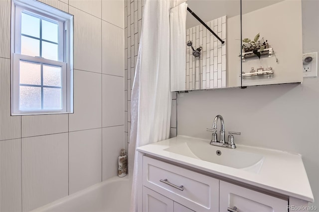 bathroom featuring vanity and shower / bath combo with shower curtain