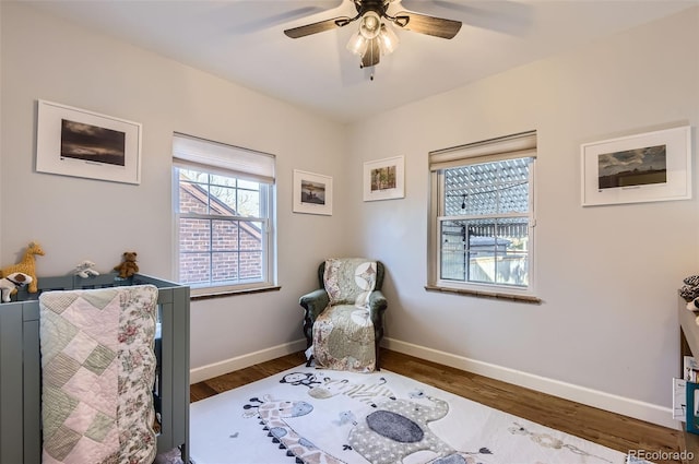 bedroom featuring ceiling fan and dark hardwood / wood-style floors