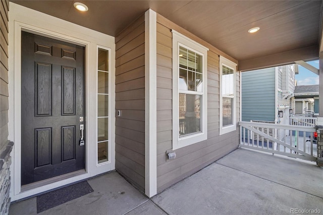 property entrance with covered porch