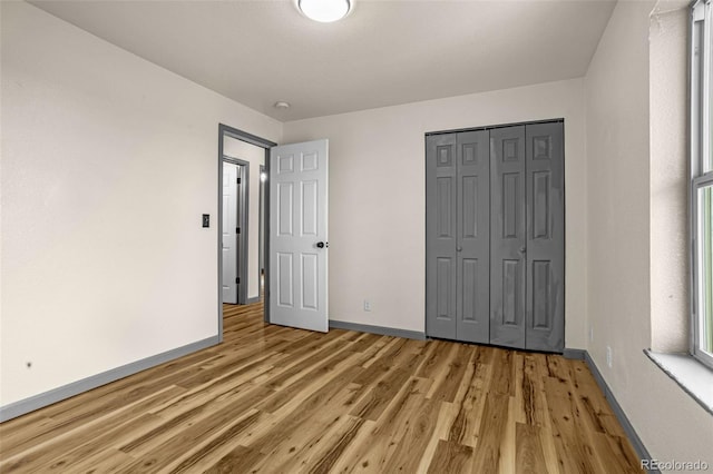 86 Will Stutley Dr, Divide, CO 80814 - unfurnished bedroom featuring light wood-style floors, baseboards, and a closet