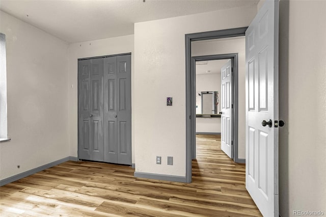 86 Will Stutley Dr, Divide, CO 80814 - unfurnished bedroom with wood finished floors, a closet, and baseboards
