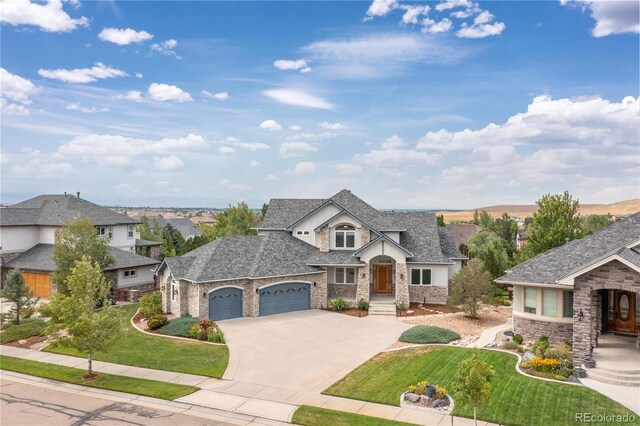 view of front of property featuring a garage and a front yard