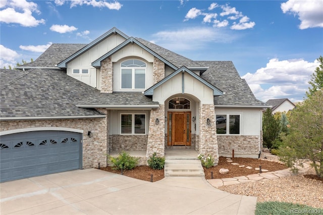 view of front of house with driveway, a garage, stone siding, roof with shingles, and stucco siding