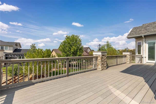 wooden deck featuring a residential view