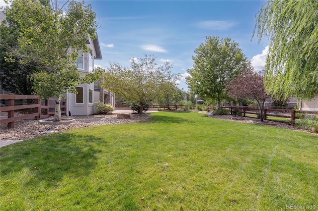 view of yard with fence