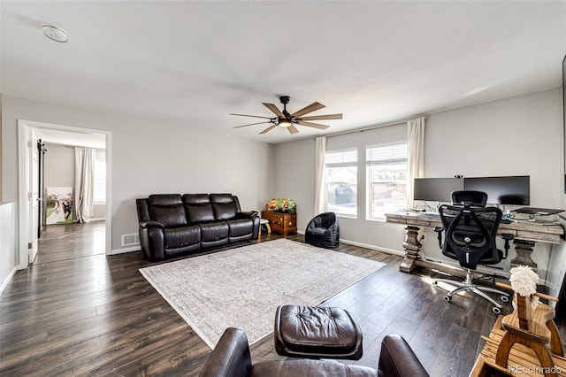 office space featuring dark hardwood / wood-style floors and ceiling fan