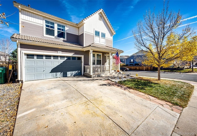 view of property featuring a porch and a garage