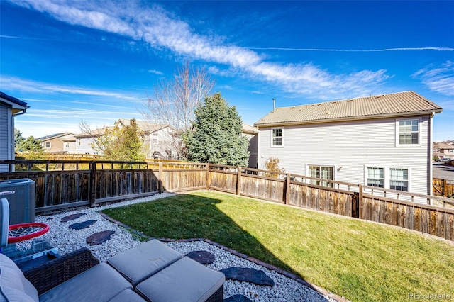 view of yard featuring an outdoor living space and central AC