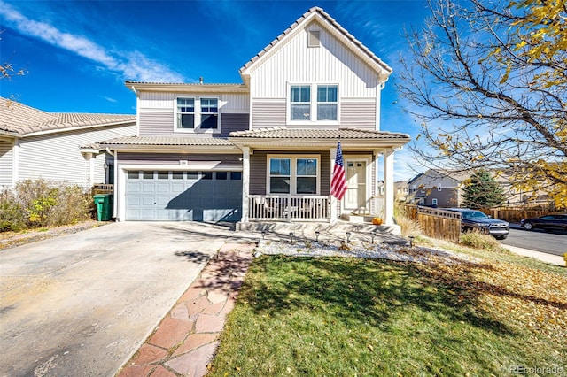 view of front facade featuring a front yard, a porch, and a garage