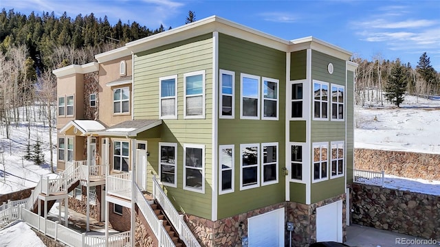 view of front of property featuring stairs