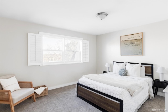 carpeted bedroom featuring baseboards