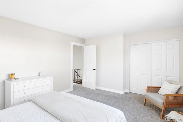 bedroom featuring carpet floors, a closet, and baseboards