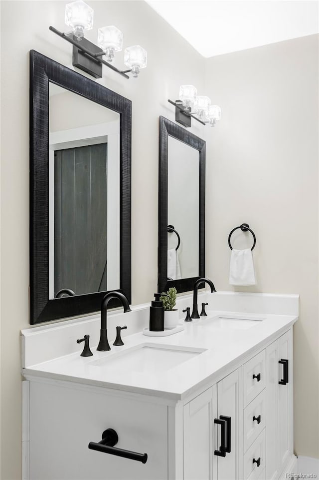 full bath with a sink and double vanity