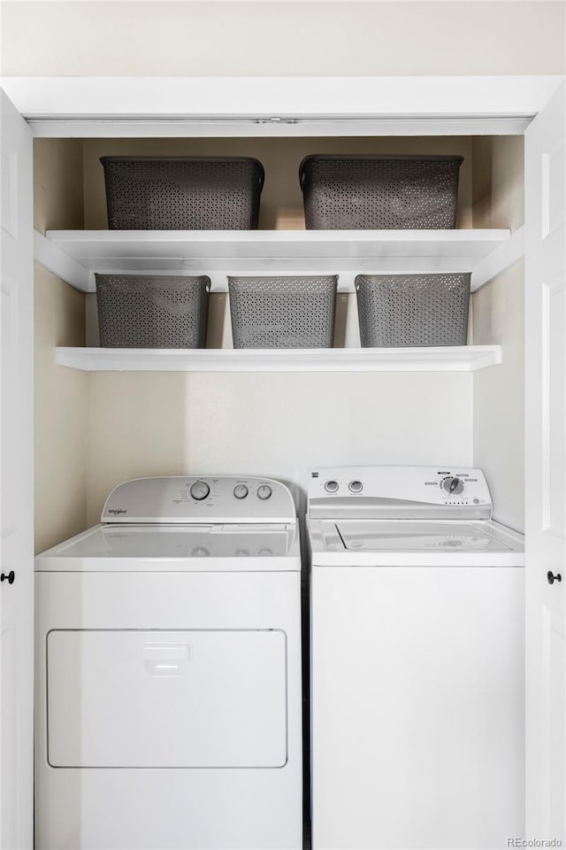 washroom with laundry area and washer and clothes dryer