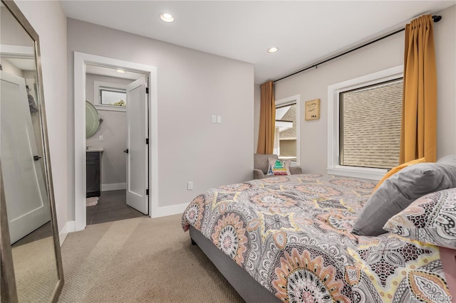 bedroom featuring light colored carpet