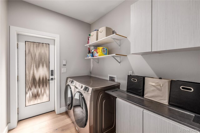 washroom featuring independent washer and dryer and light hardwood / wood-style flooring