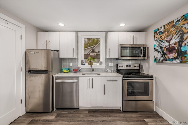 kitchen with white cabinetry, sink, and appliances with stainless steel finishes