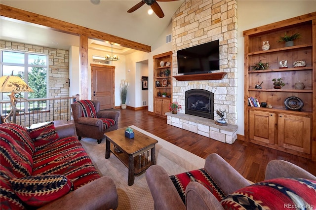 living area featuring a ceiling fan, wood finished floors, vaulted ceiling, baseboards, and a fireplace