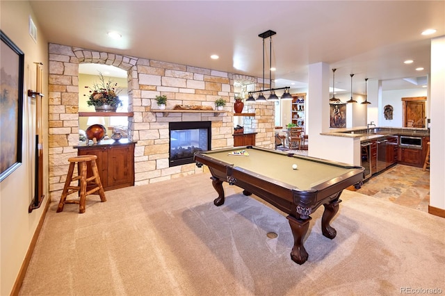 game room featuring light carpet, a stone fireplace, pool table, and recessed lighting