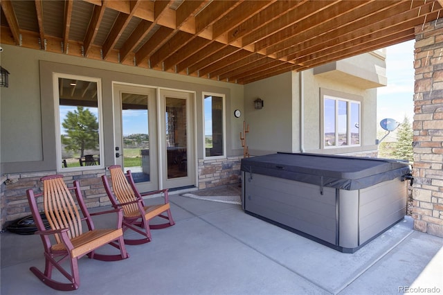 view of patio with a hot tub