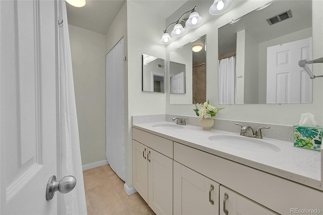 bathroom with vanity and tile patterned floors