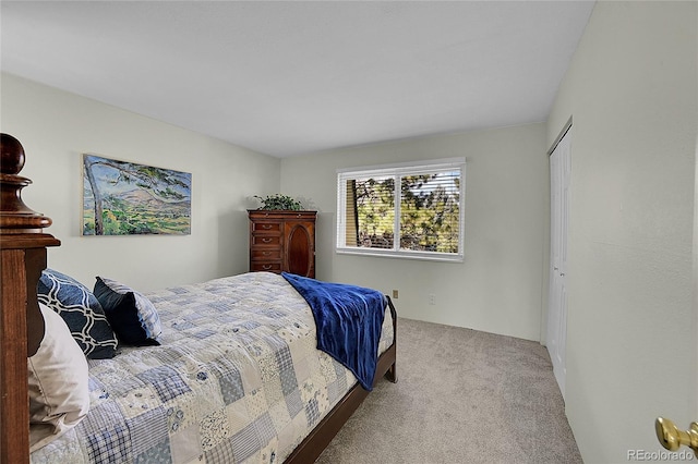 bedroom featuring light colored carpet