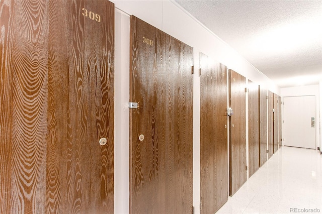 3164 S Wheeling Way Unit 308, Aurora, CO 80014 - hallway with a textured ceiling