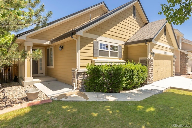 16102 Grebe Pl, Parker, CO 80134 - craftsman-style home with an attached garage, a front lawn, driveway, and stone siding