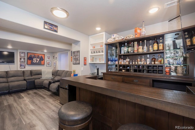 16102 Grebe Pl, Parker, CO 80134 - indoor wet bar featuring wood finished floors