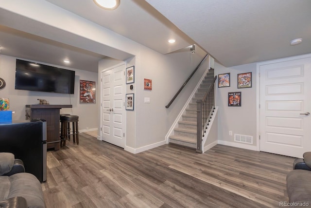 16102 Grebe Pl, Parker, CO 80134 - living room with baseboards, stairway, wood finished floors, and recessed lighting